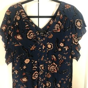 Sanctuary short sleeved blouse v-neck front and back.